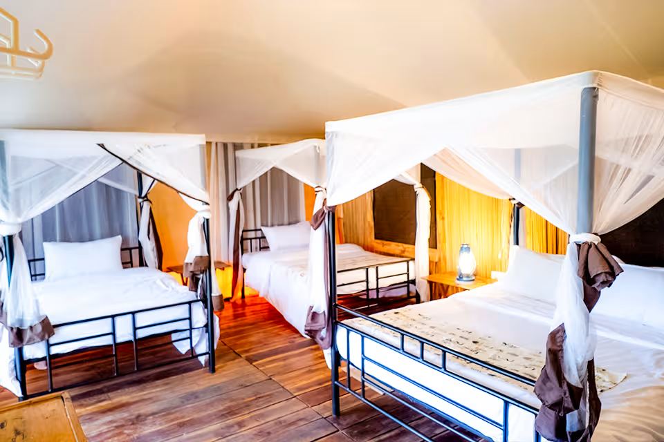 Triple Tented Room: the bed, canvas walls and the view from the veranda