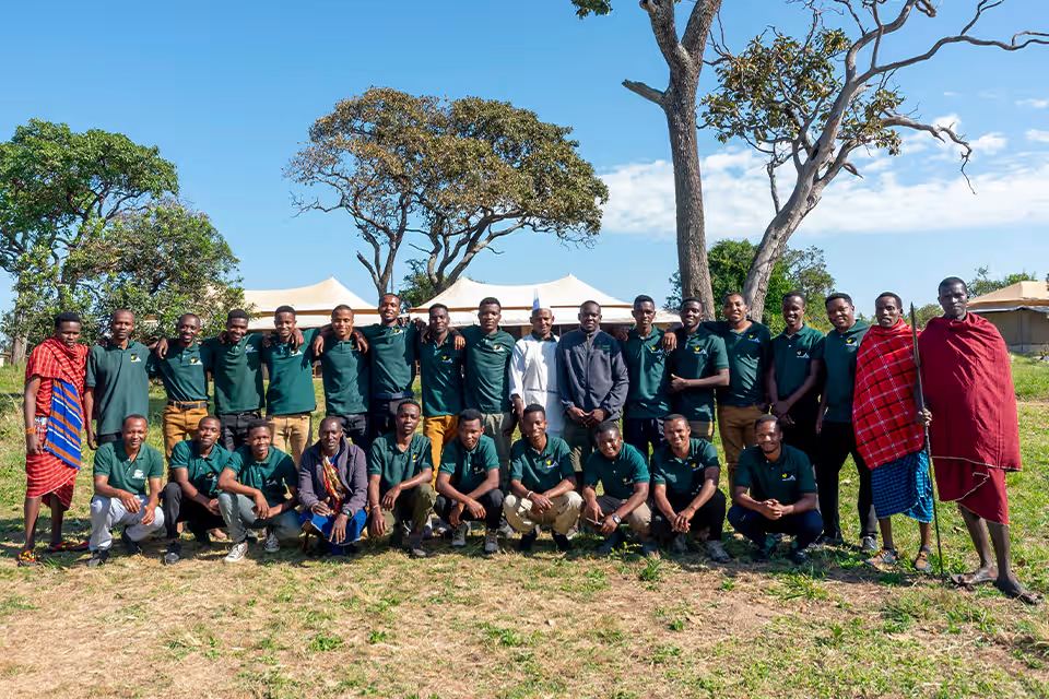 The team welcoming guests to camp