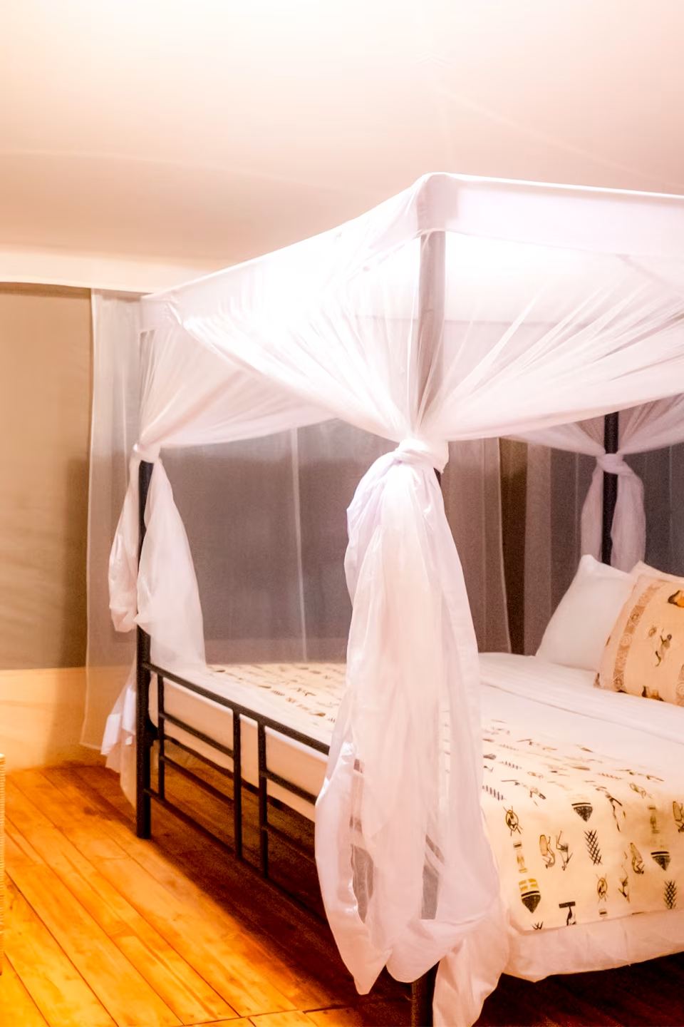 Double Tented Room: the bed, canvas walls and the view from the veranda