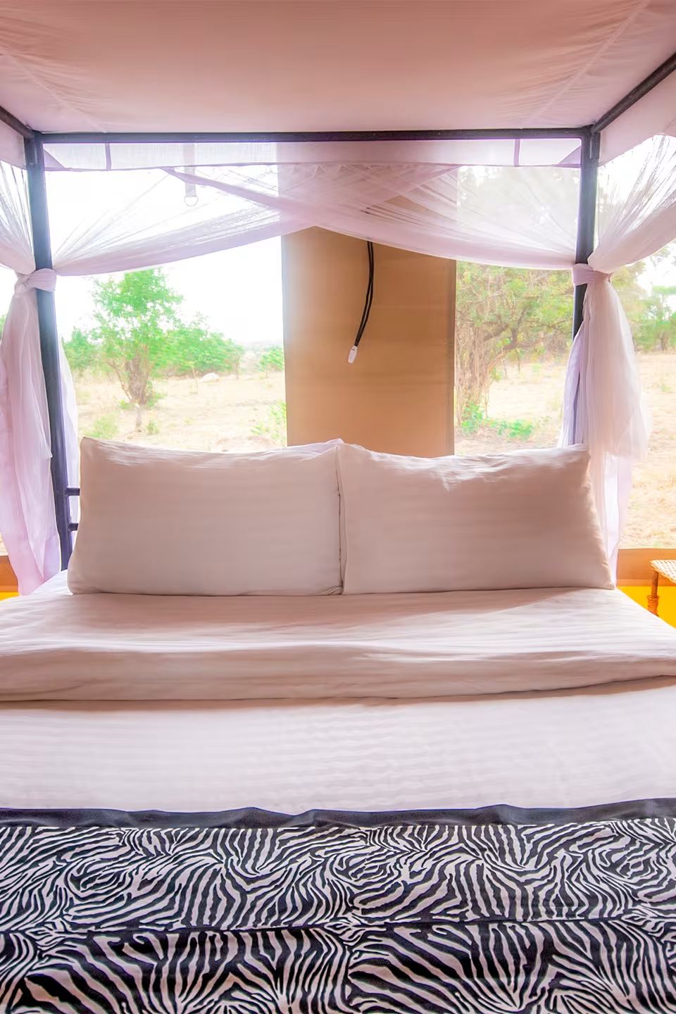 Single Tented Room: the bed, canvas walls and the view from the veranda